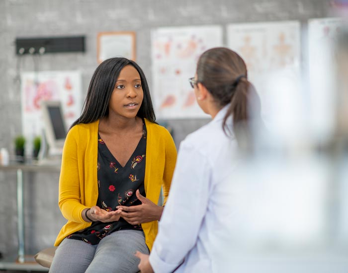 Woman talking to the doctor about fertility problems in Greater NYC