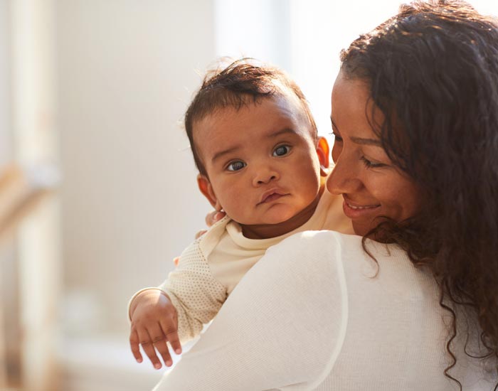 A mother holding a child